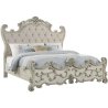 Ornate Carved Panel Bed with Upholstered Headboard