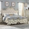 Ornate Carved Panel Bed with Upholstered Headboard