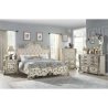 Ornate Carved Panel Bed with Upholstered Headboard