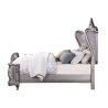 Elegant Upholstered Tufted Bed with Ornate Carving