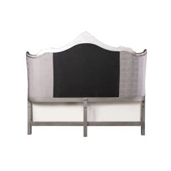 Elegant Upholstered Tufted Bed with Ornate Carving
