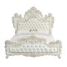 Luxurious Ornate White Tufted Bed with Detailed Carvings