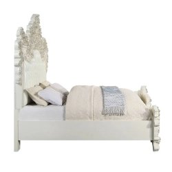 Luxurious Ornate White Tufted Bed with Detailed Carvings