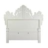 Luxurious Ornate White Tufted Bed with Detailed Carvings