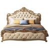 Classic Luxury Upholstered Bed with Ornate Wood Carvings