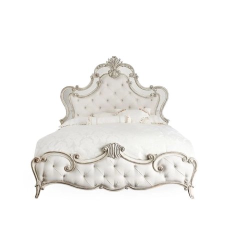 Luxurious Tufted Upholstered Bed with Ornate Carved Accents