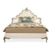 Elegant Upholstered Bed with Ornate Carved Details