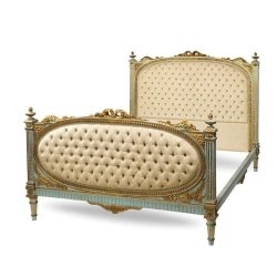 Luxury Tufted Fabric Bed with Carved Wood Frame and Gold Accents
