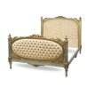 Luxury Tufted Fabric Bed with Carved Wood Frame and Gold Accents
