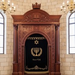 Premium handcrafted Aron Kodesh: Timeless synagogue furniture with expert carving and rich gold embroidery for sacred spaces.