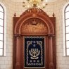 Premium Aron Kodesh: Expertly carved wooden Holy Ark with velvet parochet, a masterpiece of synagogue furniture.