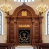 Magnificent Aron Kodesh with handcrafted solid wood and rich gold-embroidered velvet doors, perfect for any synagogue.