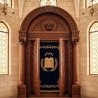Exquisite handcrafted Aron Kodesh, premium solid wood synagogue furniture with detailed velvet and gold embroidery.