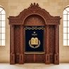 Handcrafted Aron Kodesh: exquisite wood carvings, deep blue velvet menorah curtain, premium synagogue furniture manufacturing.