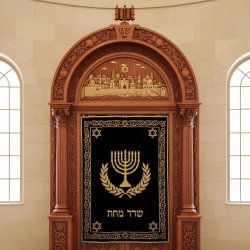 Exquisite Hand-Carved Aron Kodesh, a masterpiece of synagogue furniture with gold embroidered velvet and rich hardwood details.