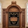Mastercrafted Aron Kodesh with intricate wood carvings and luxurious embroidered sapphire parochet for sacred synagogue spaces.