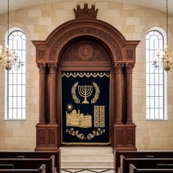 Masterfully crafted Aron Kodesh: premium hardwood, intricate carvings, traditional synagogue design by expert manufacturers.