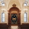 Premium handcrafted Aron Kodesh: Solid wood, deep blue velvet, golden embroidery, bespoke synagogue furniture.
