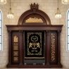 Majestic Aron Kodesh: Hand-carved wood and deep blue velvet, a testament to exquisite furniture craftsmanship for sacred spaces.