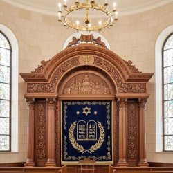 Stunning Aron Kodesh with royal blue and gold embroidery, showcasing superior manufacturing quality for synagogues.