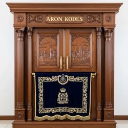 A realistic image of Mahogany Wood Aron Kodesh, Torah Ark hand carvings, image generated by Gemini-2.5-Flash.