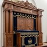 A realistic image of Mahogany Wood Aron Kodesh, Torah Ark hand carvings, image generated by Gemini-2.5-Flash.