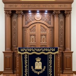 A realistic image of Mahogany Wood Aron Kodesh, Torah Ark hand carvings, image generated by Gemini-2.5-Flash.