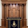 A realistic image of Mahogany Wood Aron Kodesh, Torah Ark hand carvings, image generated by Gemini-2.5-Flash.