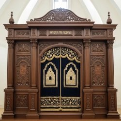 A realistic image of Mahogany Wood Aron Kodesh, Torah Ark hand carvings, image generated by Gemini-2.5-Flash.