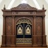 A realistic image of Mahogany Wood Aron Kodesh, Torah Ark hand carvings, image generated by Gemini-2.5-Flash.
