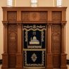 A realistic image of Mahogany Wood Aron Kodesh, Torah Ark hand carvings, image generated by Gemini-2.5-Flash.