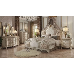 Luxury carved bed with intricate painted accents Mulyoharjo Furniture Hospitality