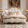 Luxurious Upholstered King Size Bed with Elegant Gold Carvings
