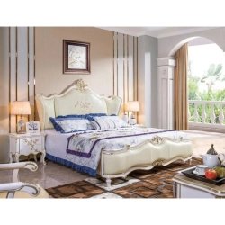Luxurious Upholstered King Size Bed with Elegant Gold Carvings
