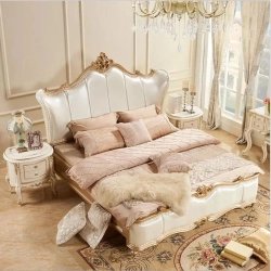 Luxurious Upholstered King Size Bed with Elegant Gold Carvings