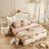 Luxurious Upholstered King Size Bed with Elegant Gold Carvings