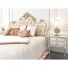 Classic Luxurious Upholstered Bed with Ornate Gold Headboard and Nightstands